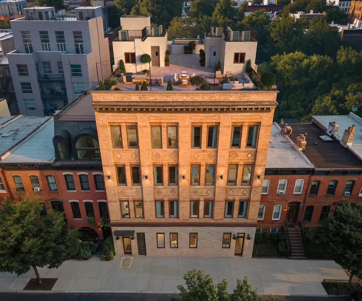Exterior of The Candy Factory at 124 Washington Avenue, Clinton Hill, Brooklyn - restored brick loft building with a landscaped rooftop terrace