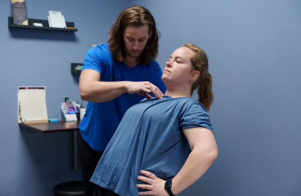  runner receiving manual therapy treatment from a physical therapist
