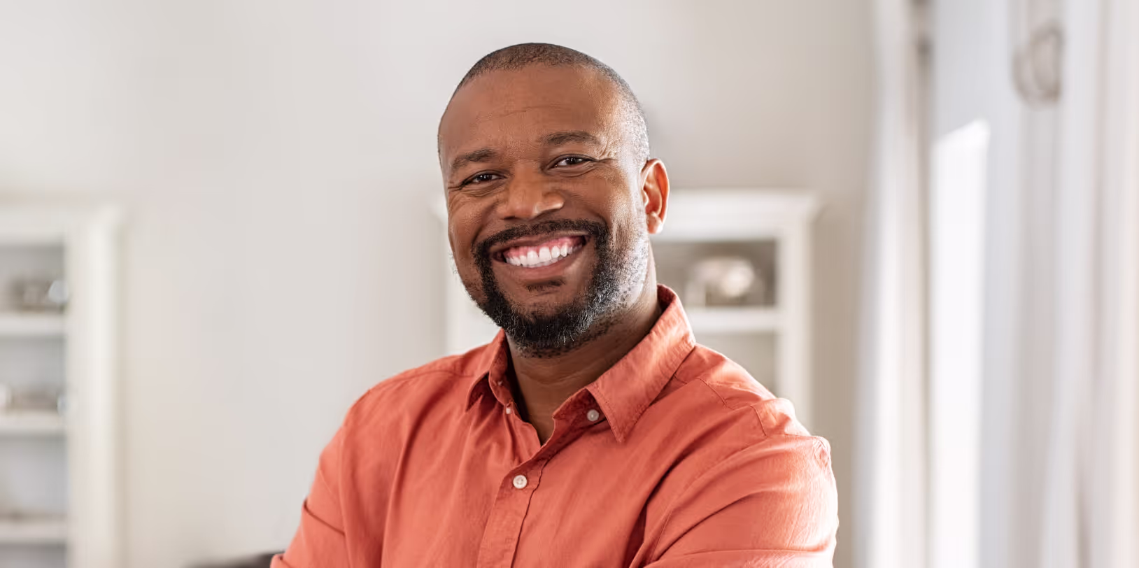 Orange shirt black man.