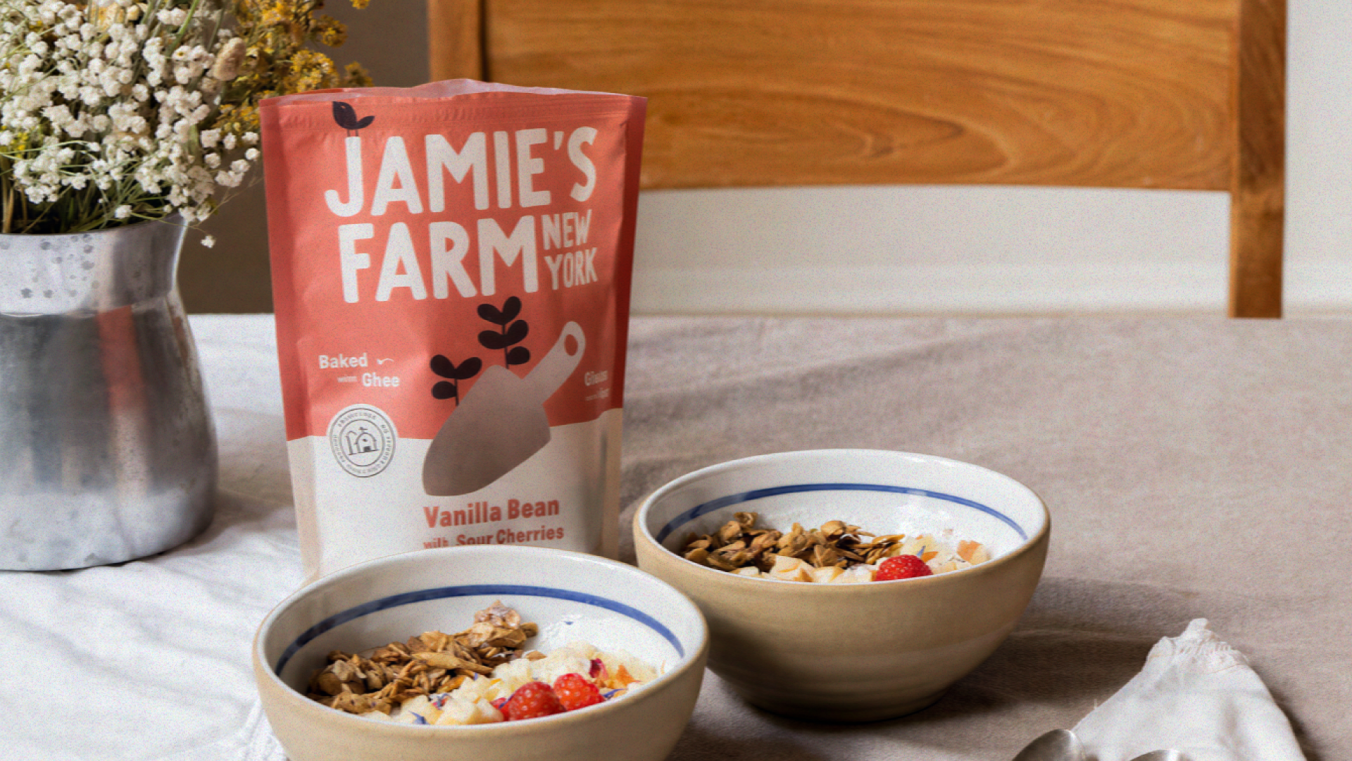 Jamie's Farm New York Vanilla Bean granola packaging with two bowls of granola and berries — brand identity design by n96 branding agency Copenhagen