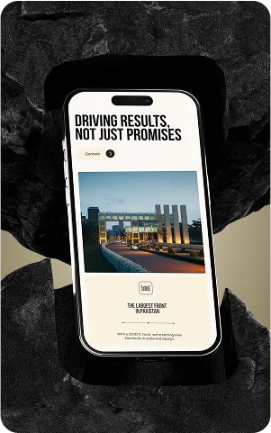 A mobile phone displays an advertisement with the text "Driving Results, Not Just Promises" over a background featuring a modern building.