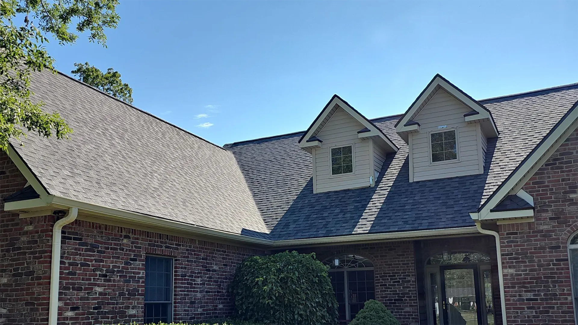 Asphalt shingle roof installation on brick home in Central Indiana