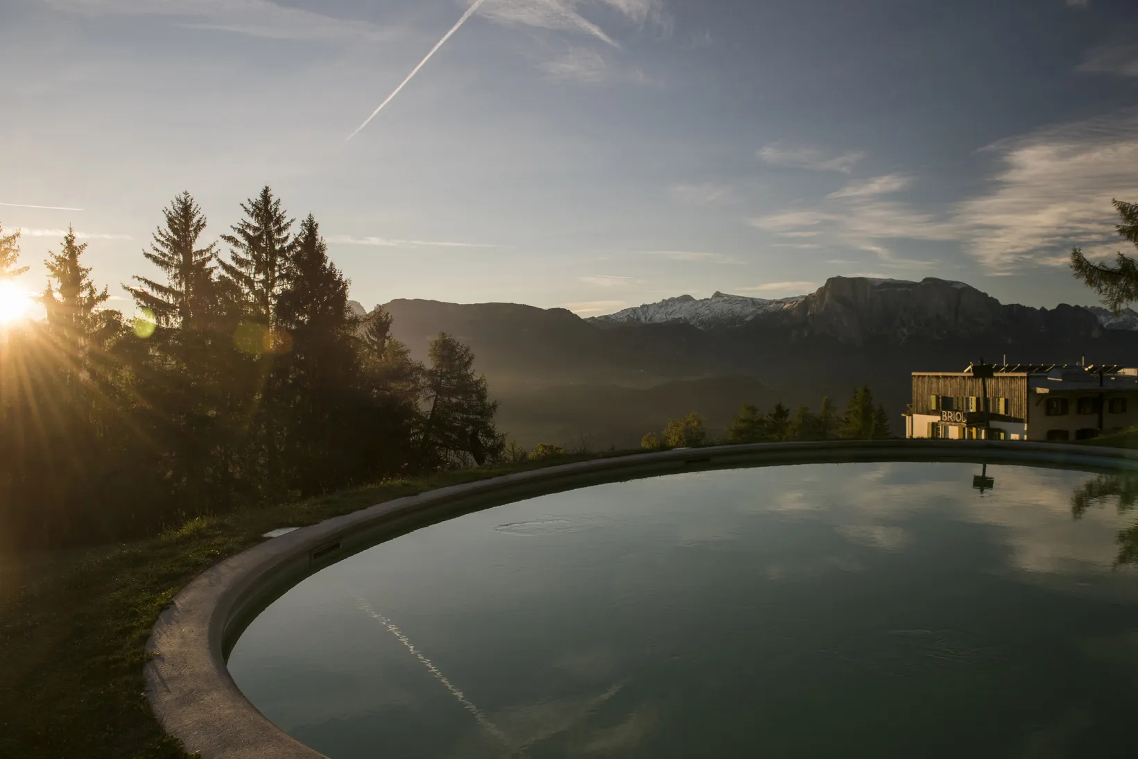 Mountain ridgeline and Bauhaus-style Pension Briol in South Tyrol.