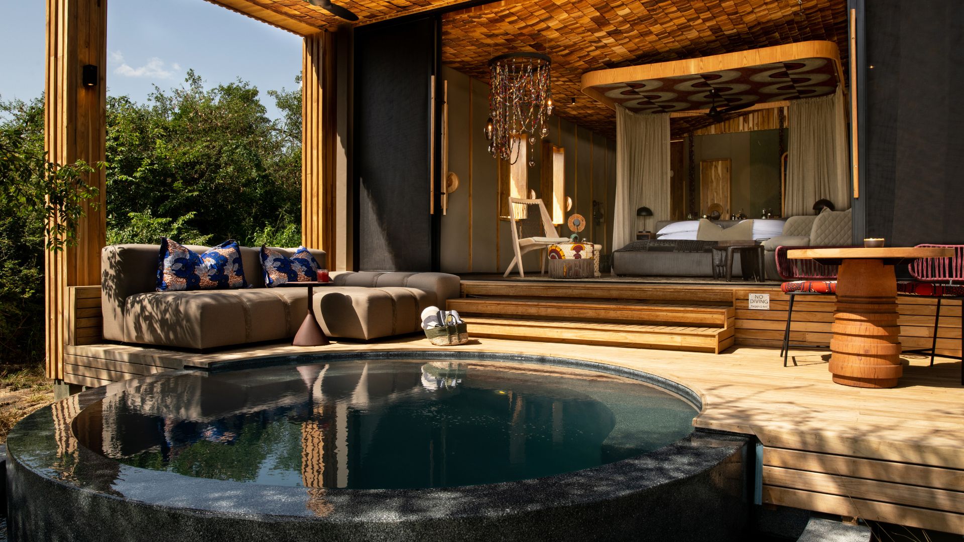 Every suite features a private plunge pool and sun deck overlooking the Grumeti River.
