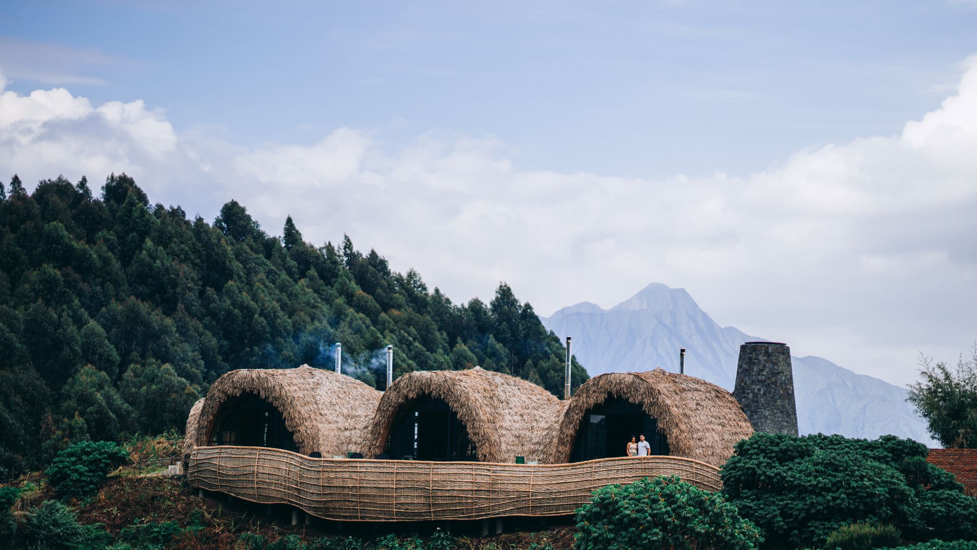 Every residence opens to dramatic panoramas of the Virunga volcanoes and reforested hills.