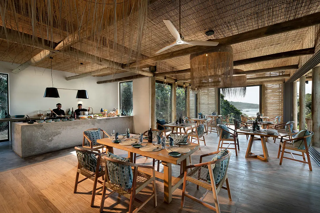 Lodge built for sustainability with minimal impact on dunes, using natural materials and solar power.