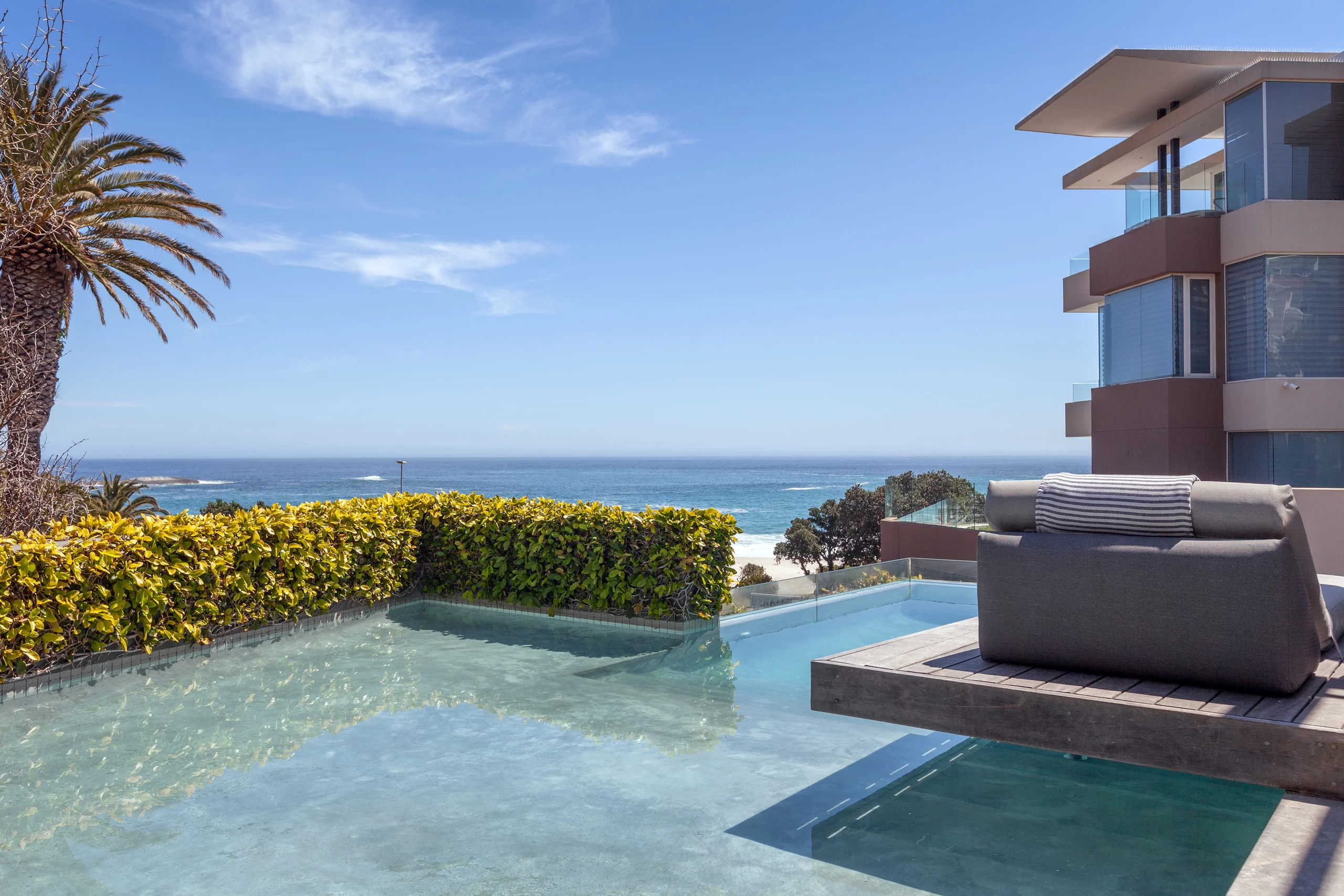 Swim or lounge with unbeatable views of Camps Bay beach and the Atlantic Ocean.