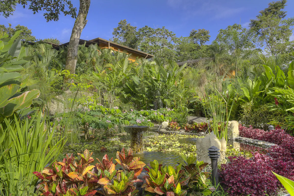 Luxury accommodations immersed within tropical gardens and volcano landscapes.