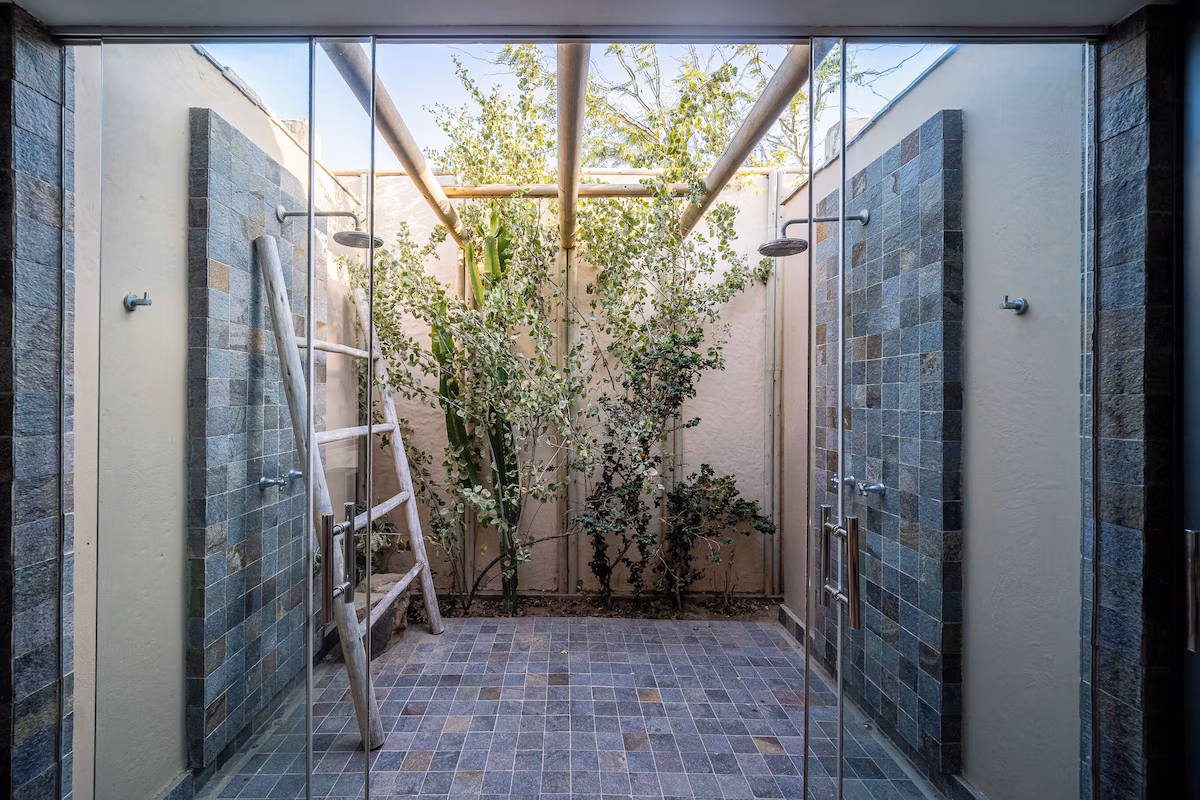 Yoga mats, open-air showers, and slow-living design.