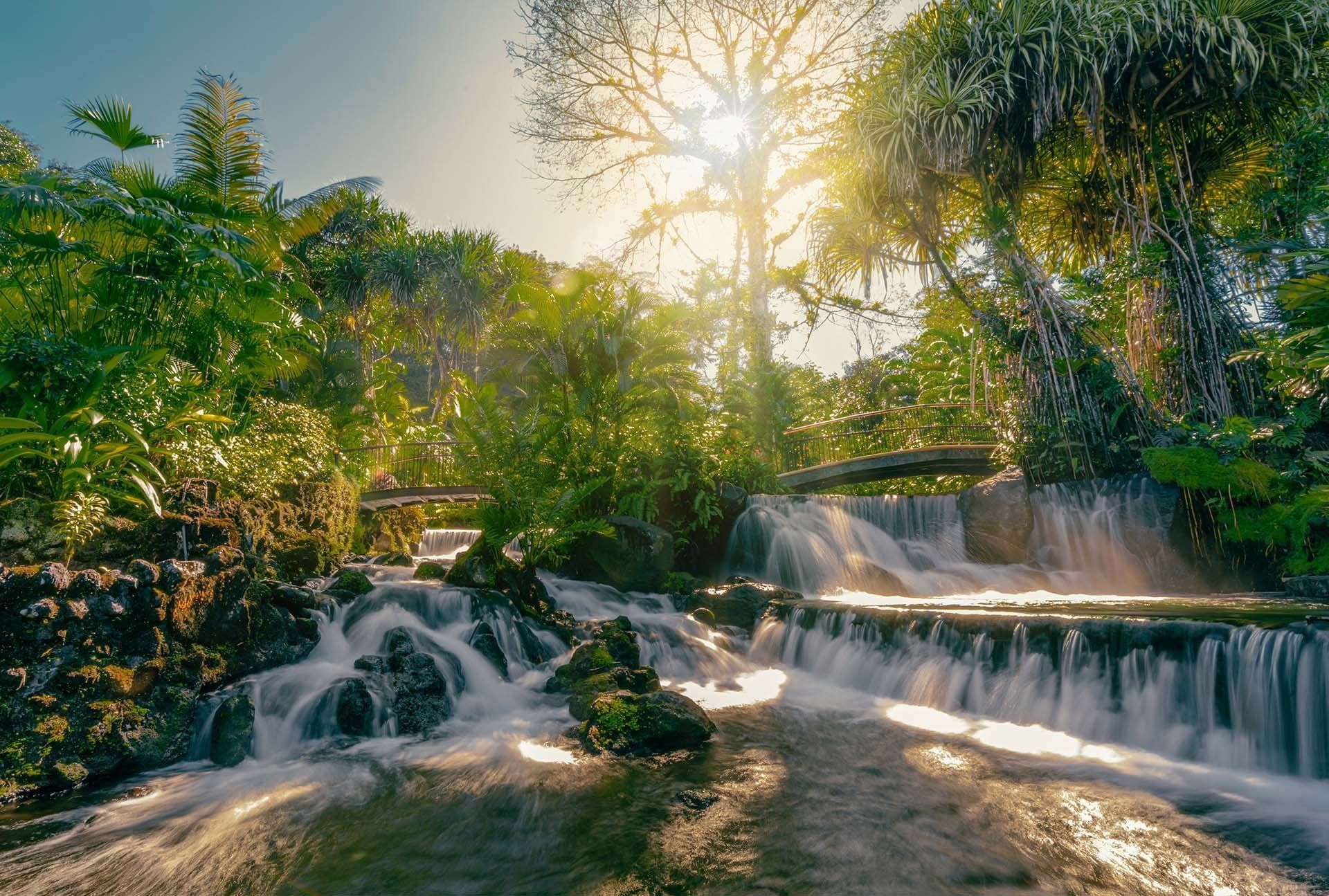 A mineral-rich river heated naturally beneath Arenal Volcano flows through tropical gardens, waterfalls and pools without being mechanically reheated or recycled.