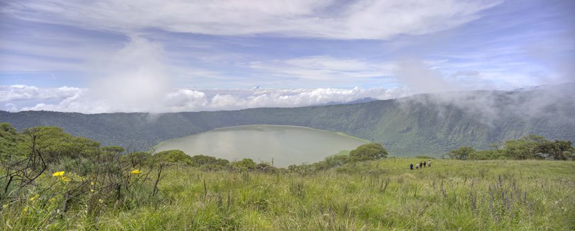 Hike directly from camp to explore volcano craters and hidden forests with expert guides.