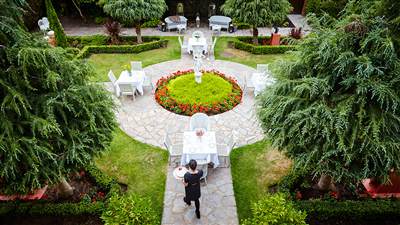 The private gardens create an elegant backdrop for dining, celebrations and quiet moments outdoors.
