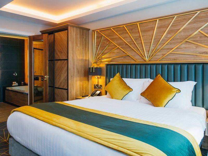 Rooms combine rich textures, jewel colors, bespoke joinery and contemporary luxury finishes. 