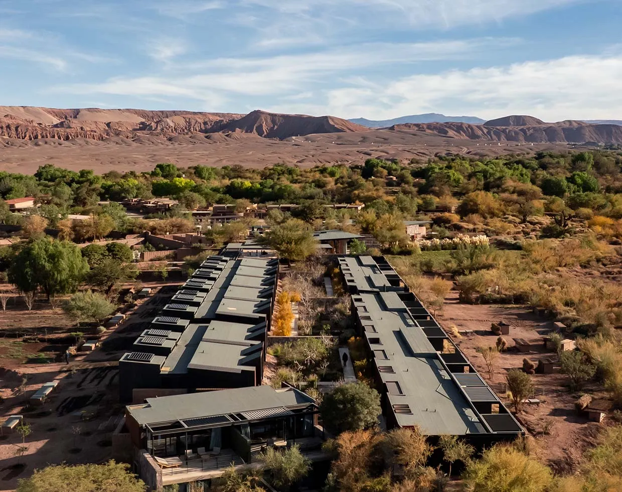Adobe-inspired buildings, natural materials and open-air courtyards blend beautifully into the surrounding desert landscape.