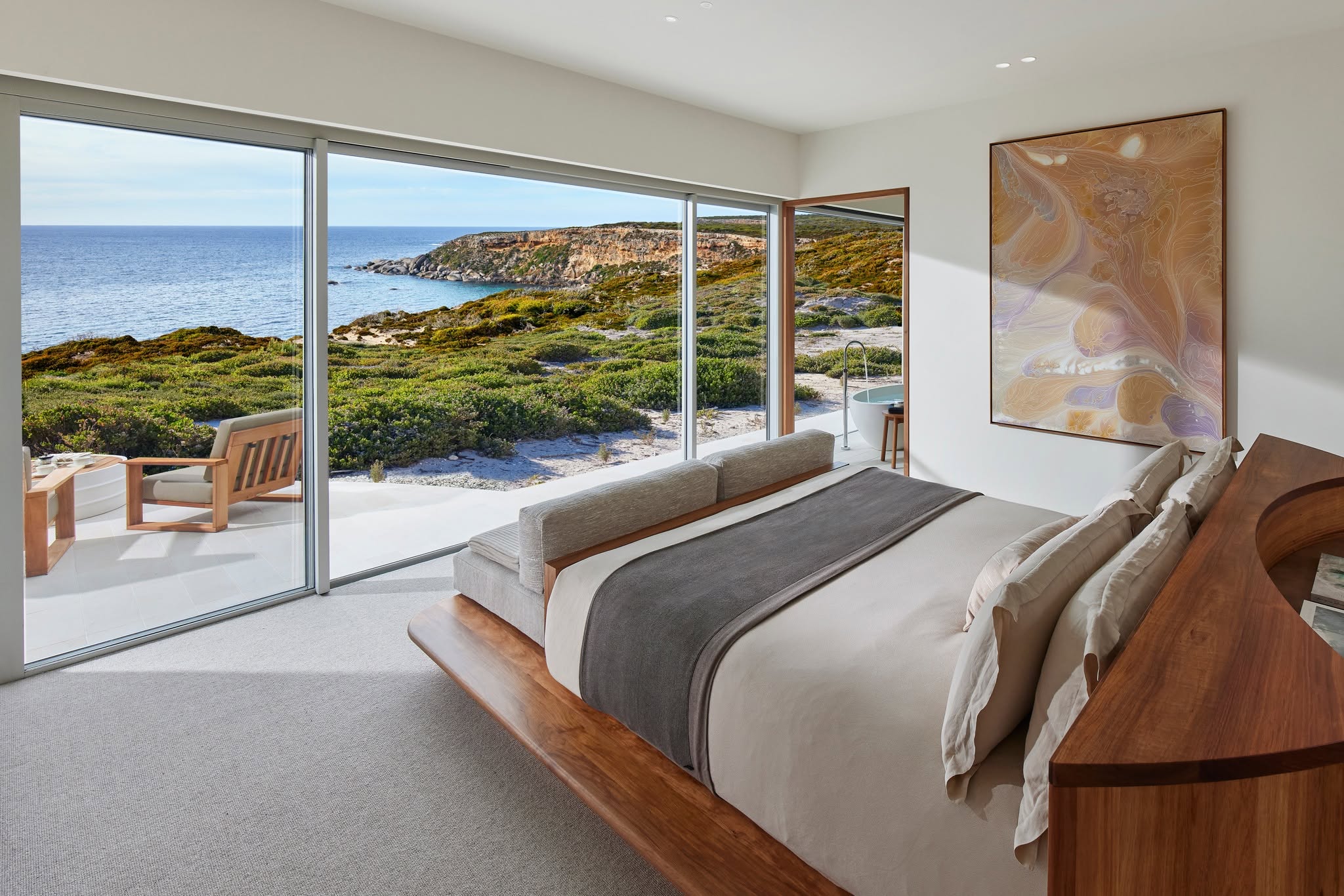 Beautifully appointed suites positioned along dramatic limestone cliffs, each offering uninterrupted Southern Ocean views from private terraces.