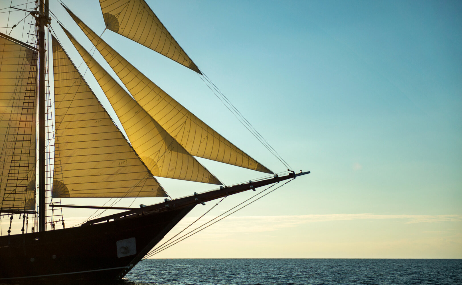 Amandira was custom designed and handcrafted from local hardwoods by Konjo artisans, inspired by historic Phinisi vessels. 