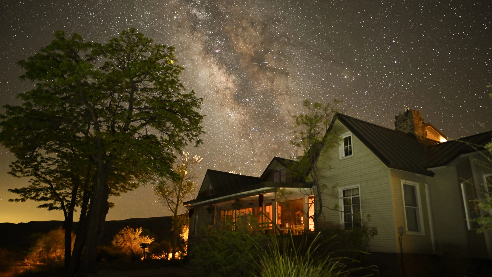 Ted Turner's private four-bedroom home offers four guest rooms and four bathrooms, with a master bedroom and two additional ensuite rooms downstairs and an upstairs suite with breakfast porch and bath.