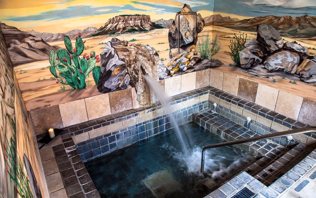 Mineral-rich geothermal waters are maintained at 104°F and form the foundation of the Sierra Grande wellness experience.