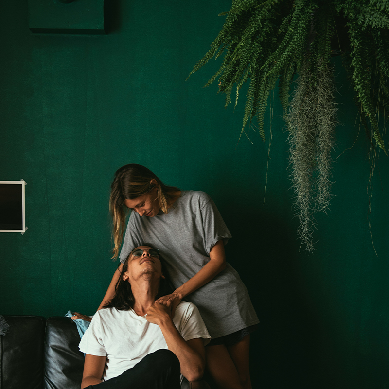 Couple sharing a moment indoors. Clean Slate Clients.