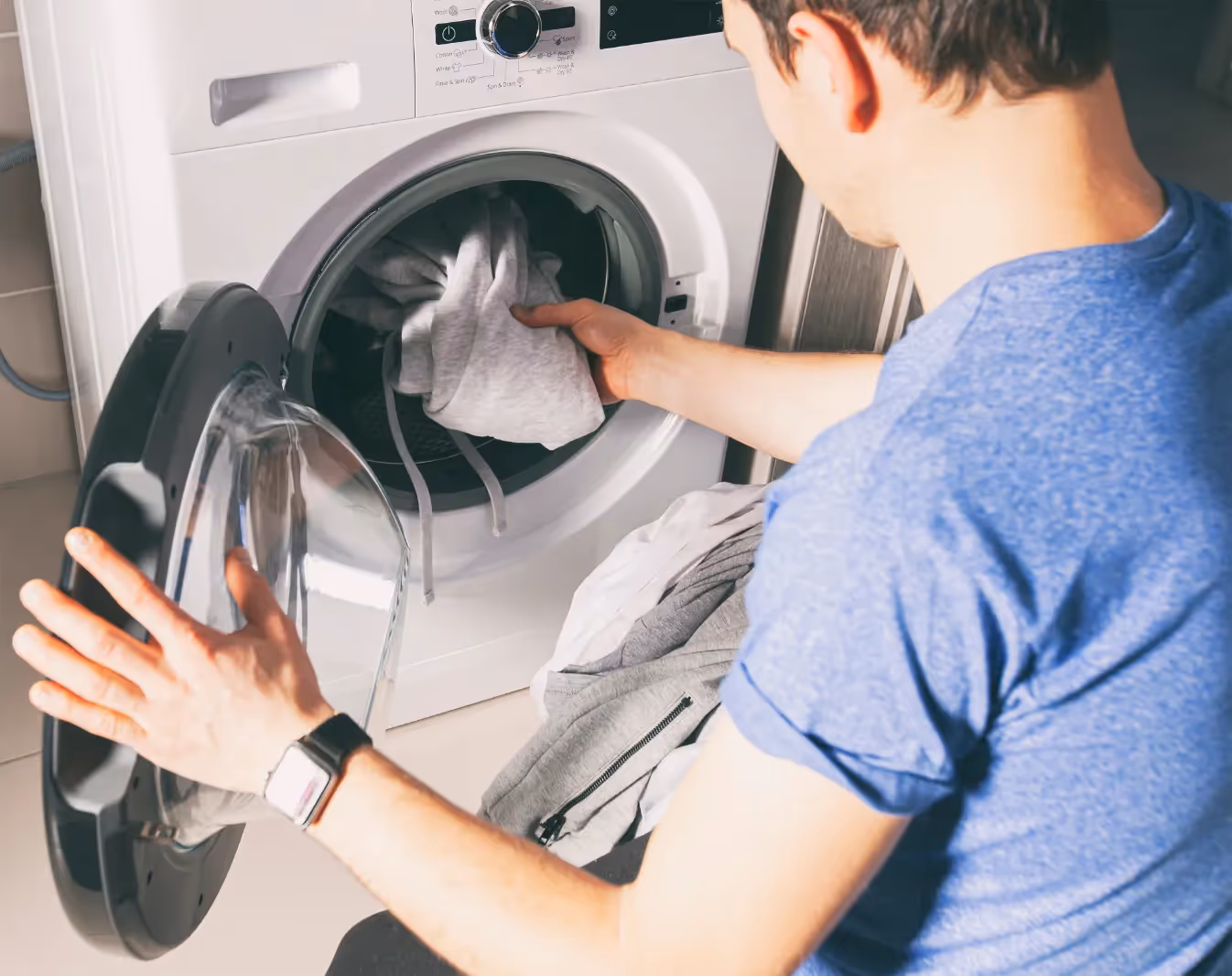 stock photo of man doing laundry