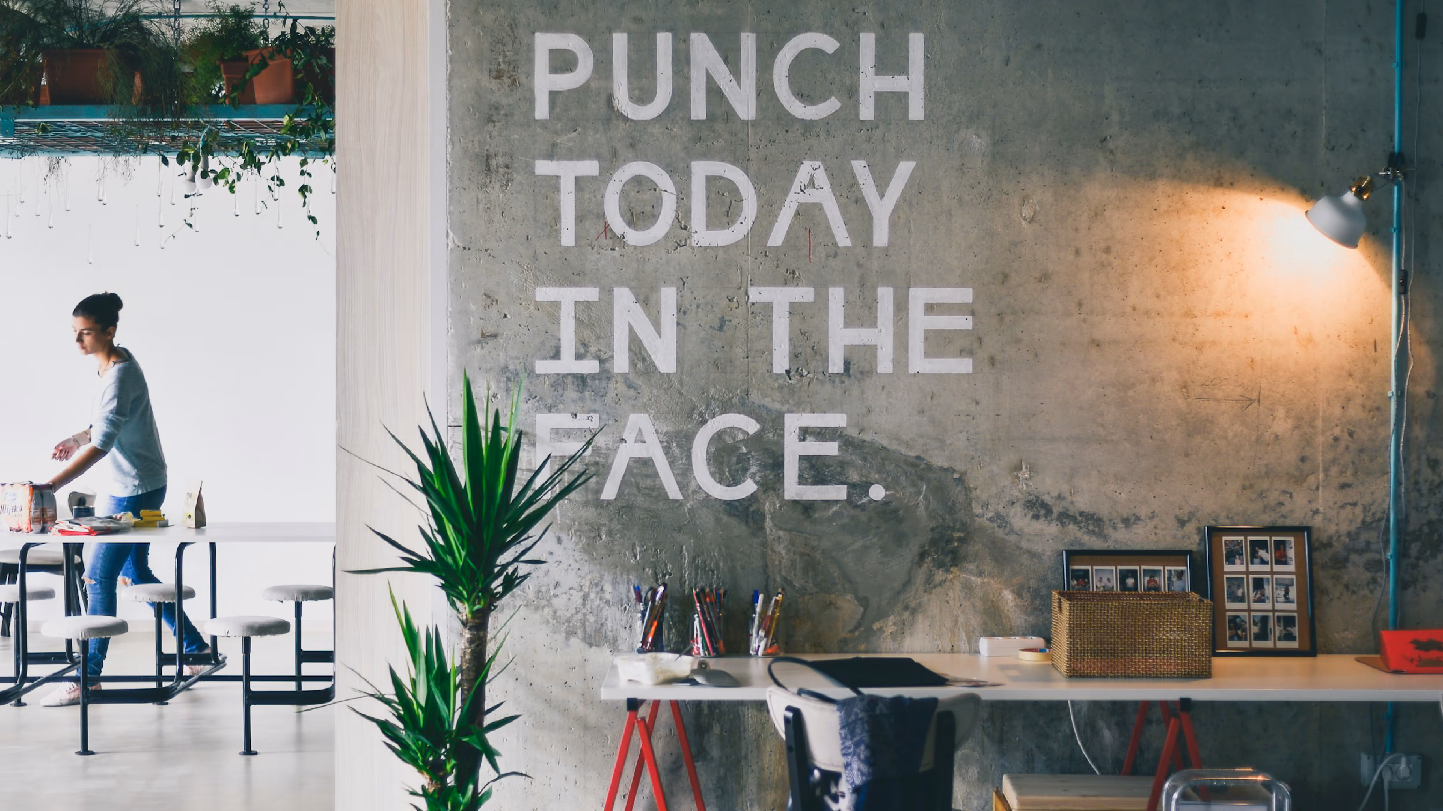 Large office space image with punch today written on the wall