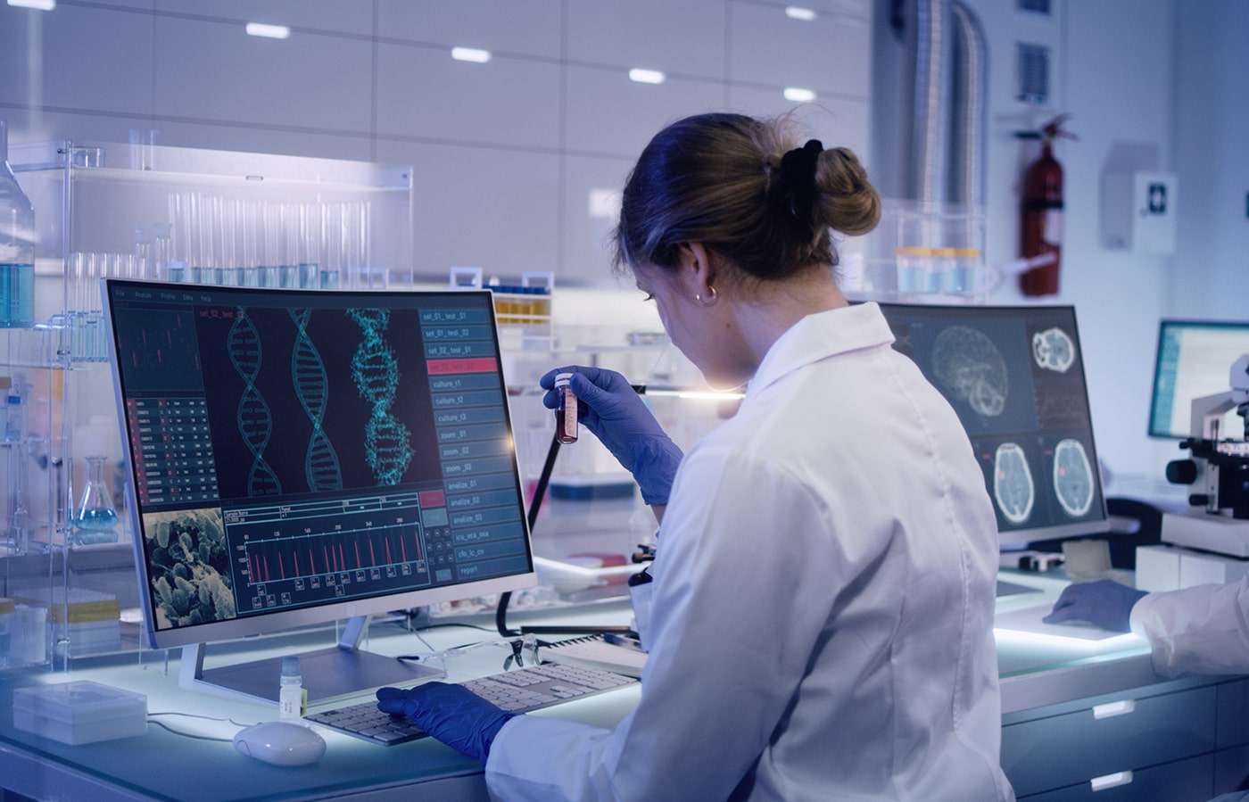 Researcher evaluating non-viral genetic payload delivery using GeneZips