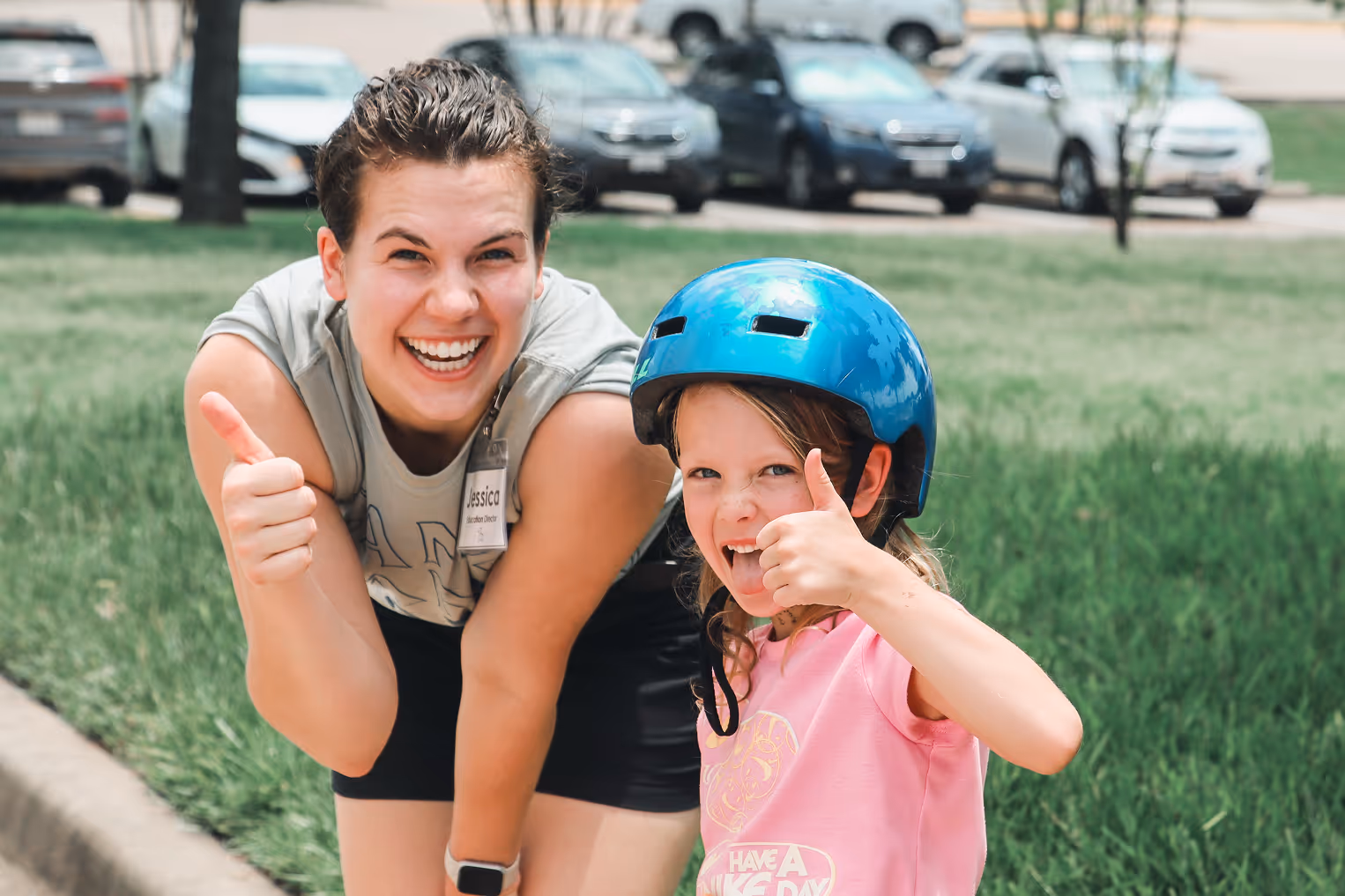Counselor and child thumbs up