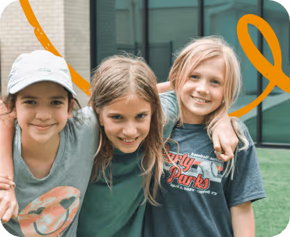 Friends smiling and holding each other