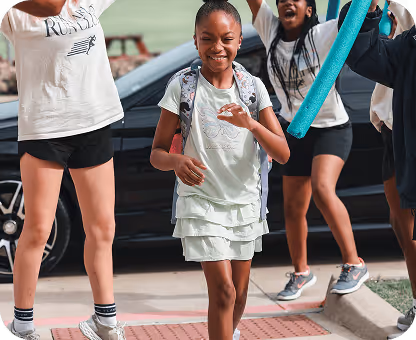 Child walking into camp skylark