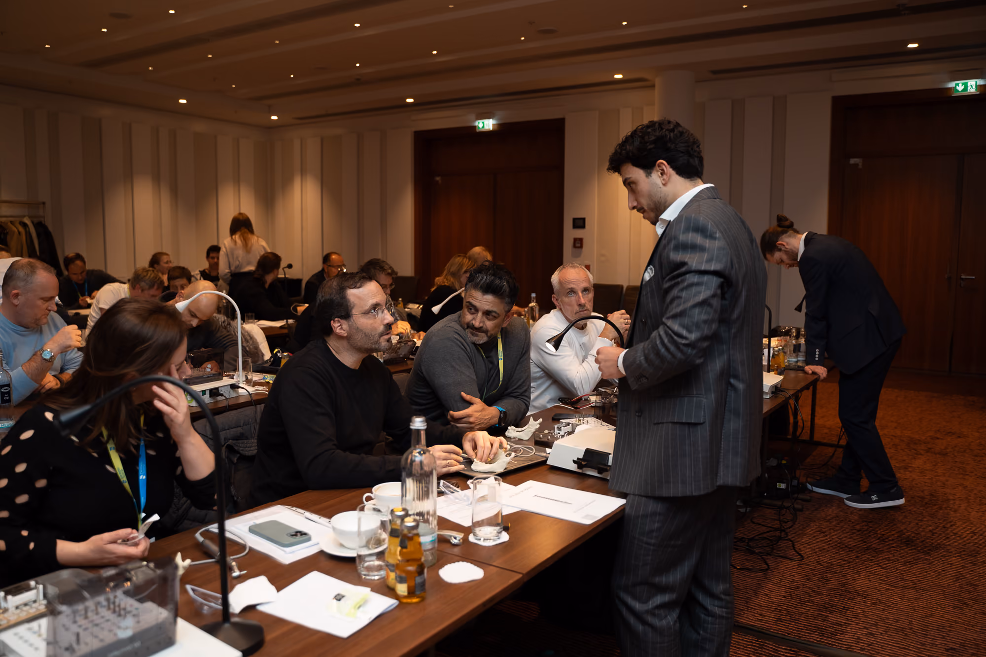Hands-on training tables with participants and instructor