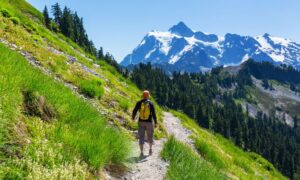 man hiking while working in travel dialysis jobs