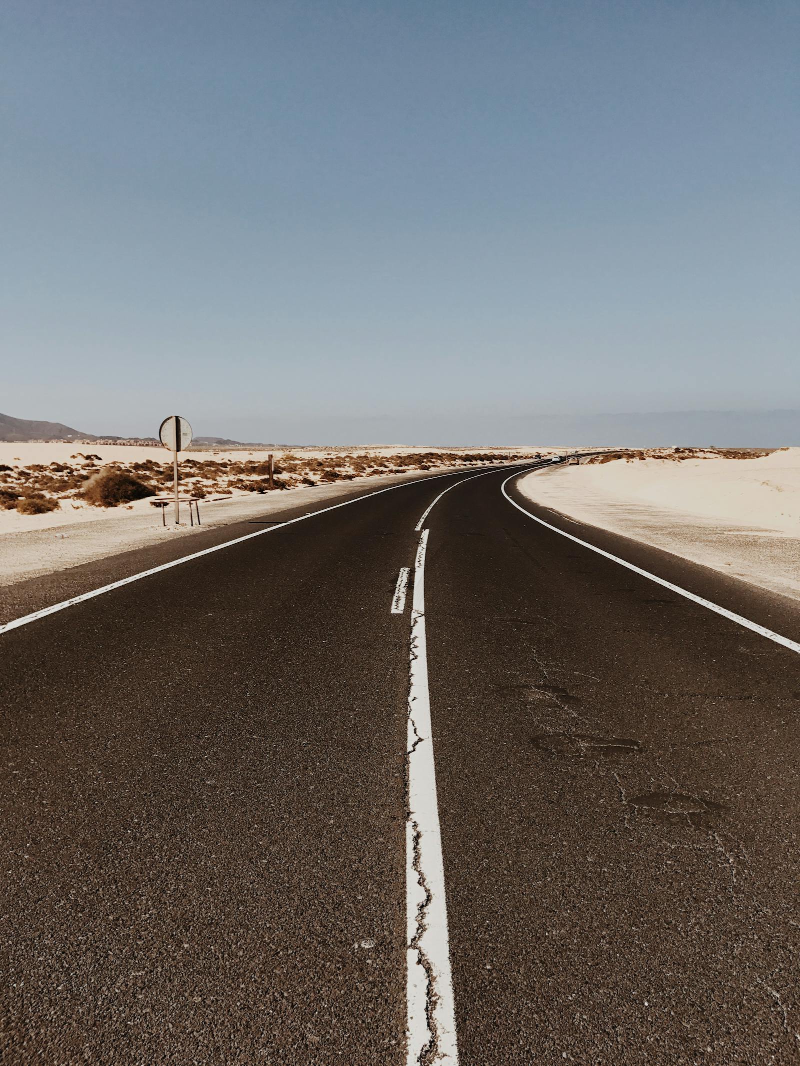 Open Spanish road through desert landscape - driving in Spain for tourists