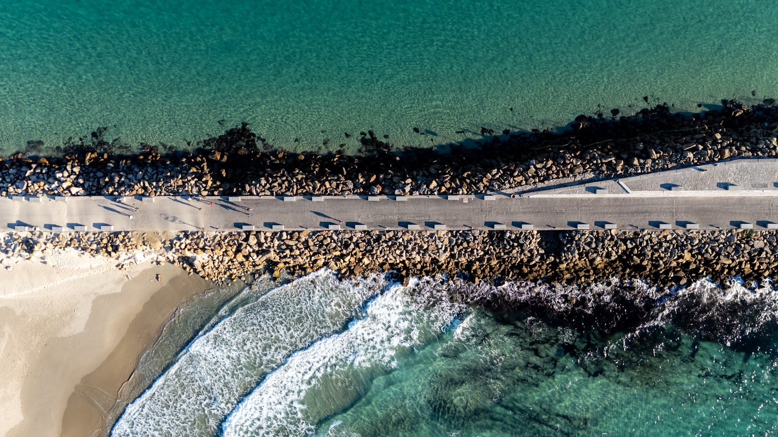 Aerial view of a rocky Mediterranean coastline with turquoise water, typical of the Costa Blanca in Spain