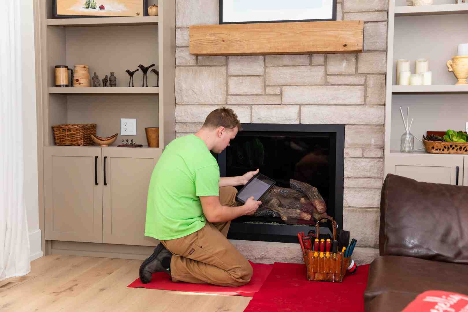 A technician servicing a gas fireplace - Certified gas technician