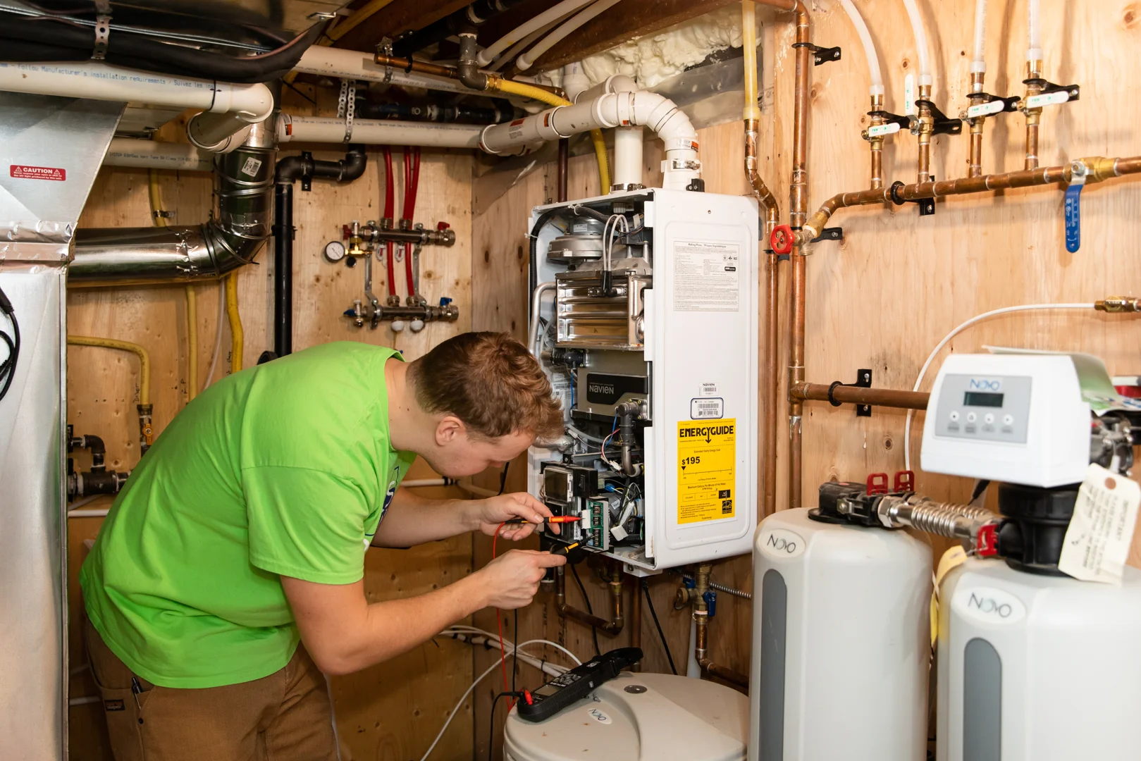 homeowner inspecting water heater