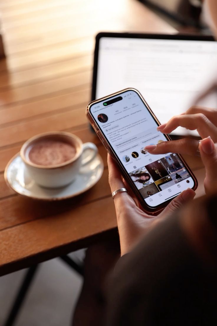 a woman using her phone to check her instagram account