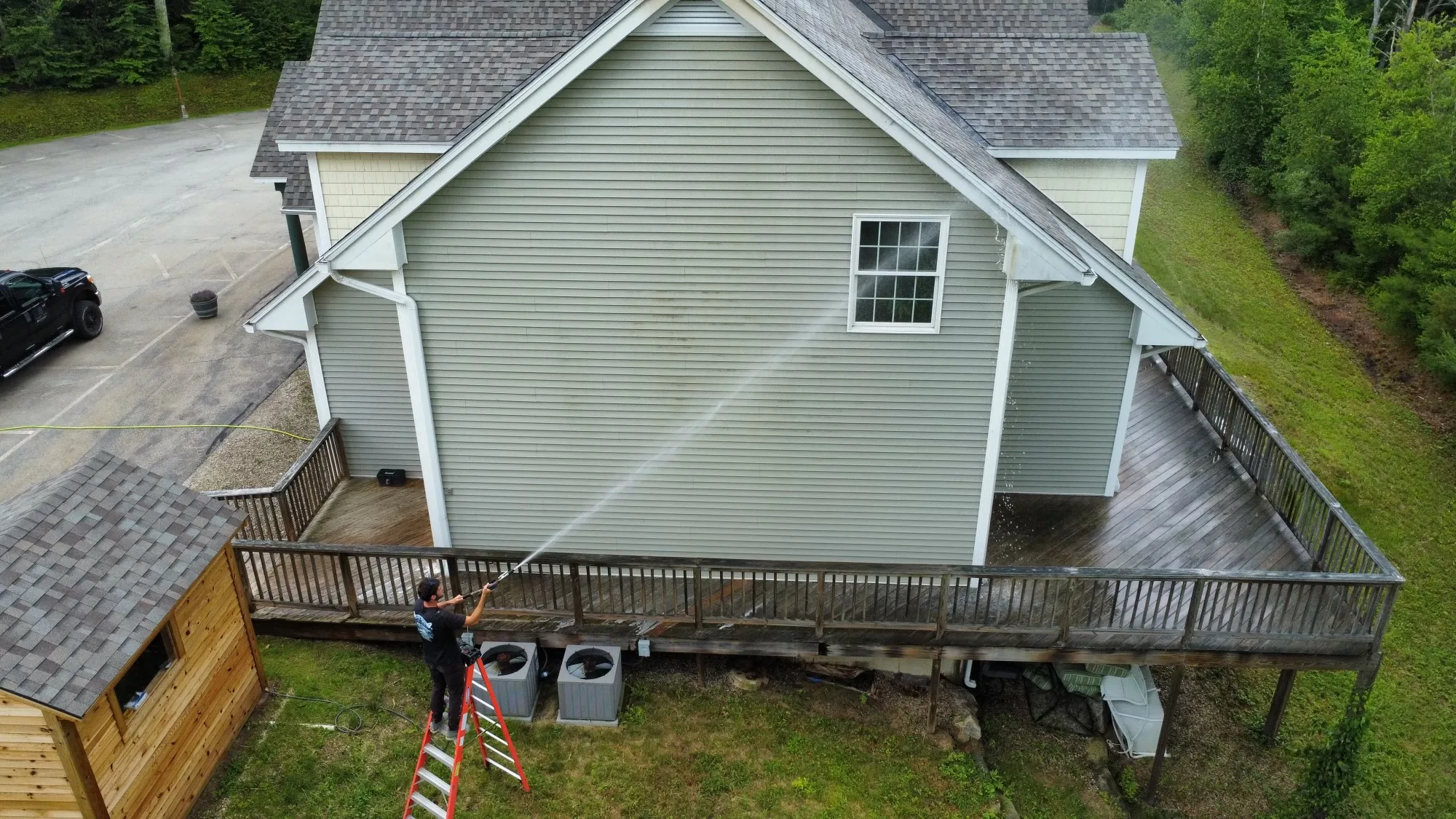 Gabe soft washing a home exterior in Seacoast NH