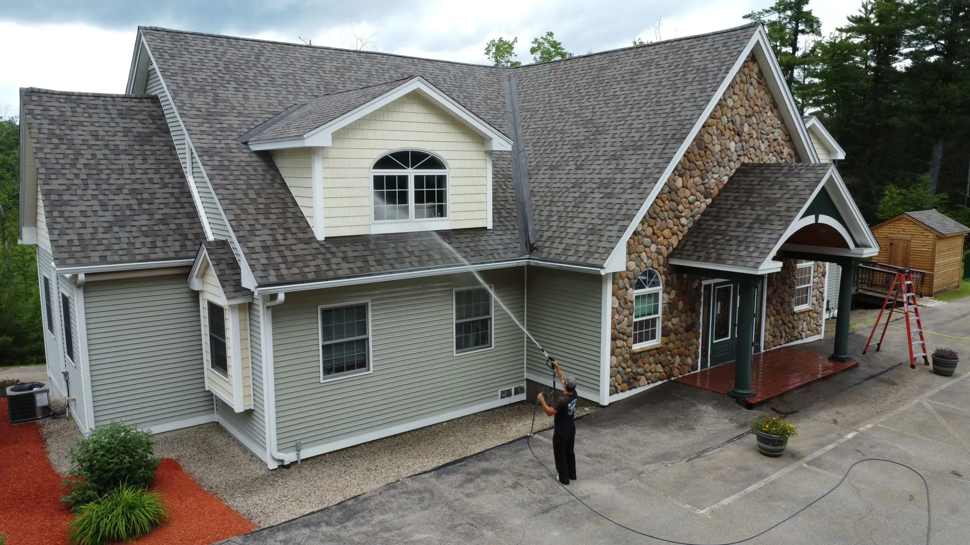 Propane tank and siding after pressure washing