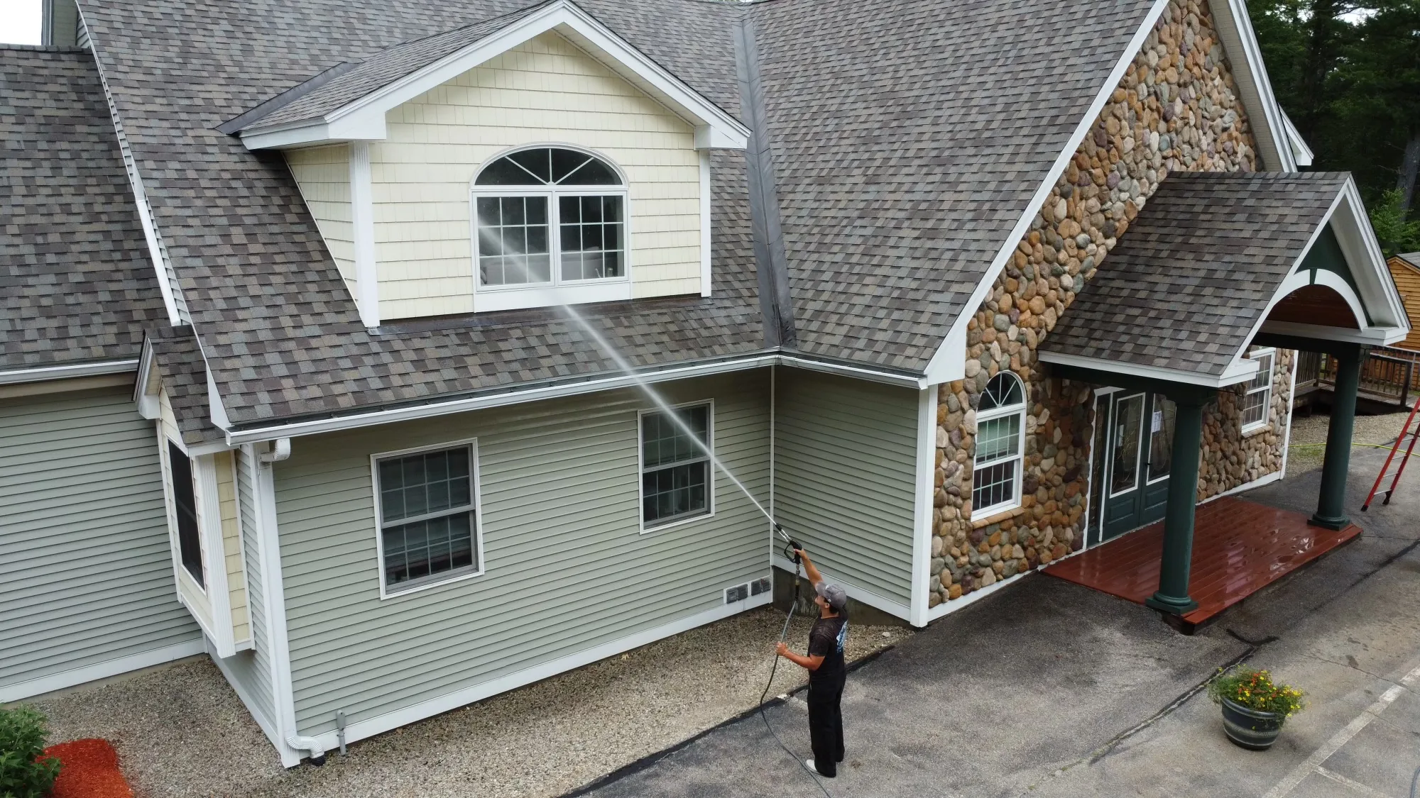 Propane tank and siding before pressure washing