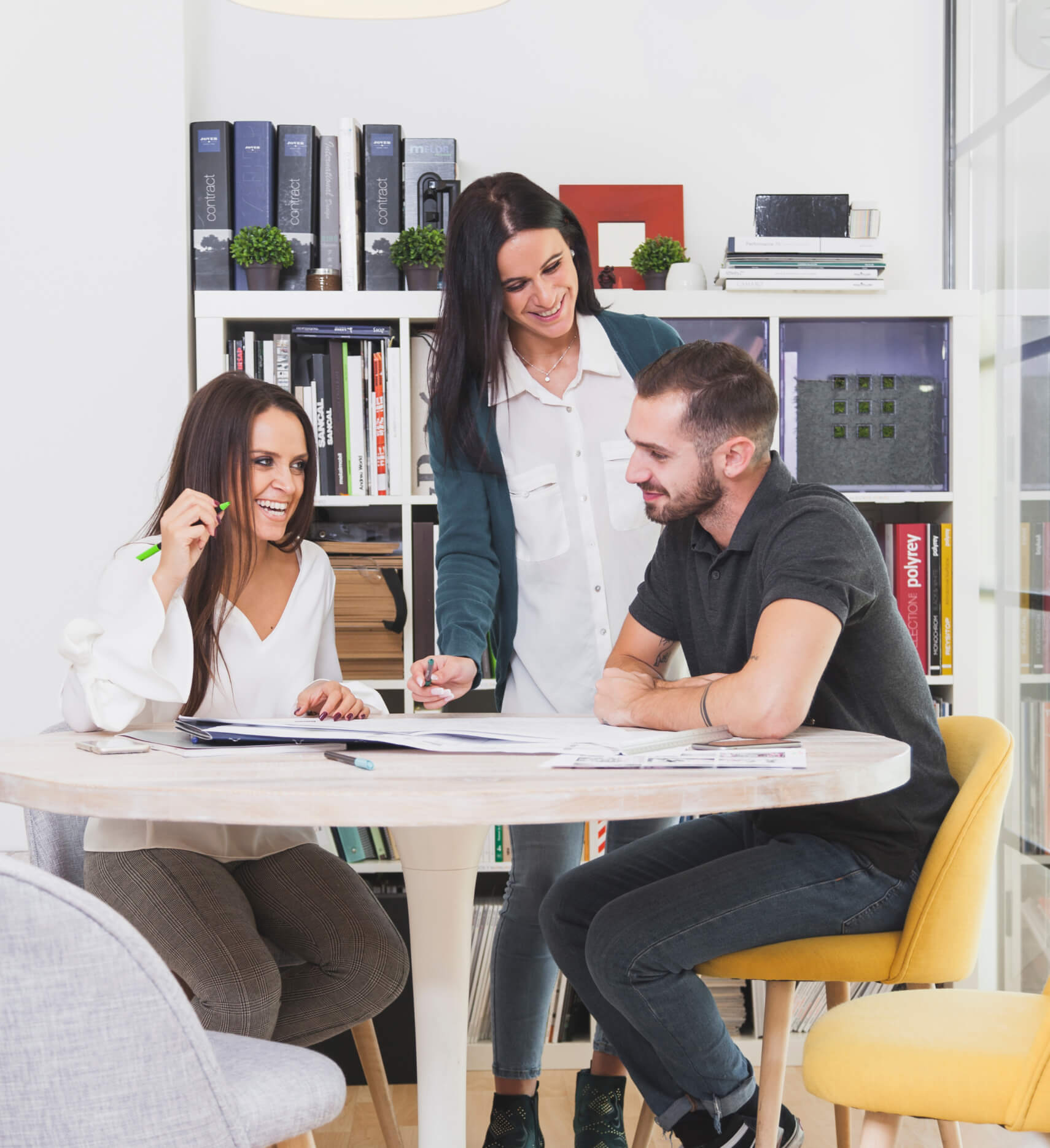 a group of people sitting around a table
