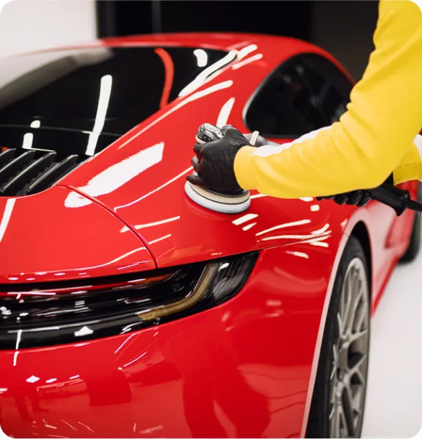 polishing a red porche