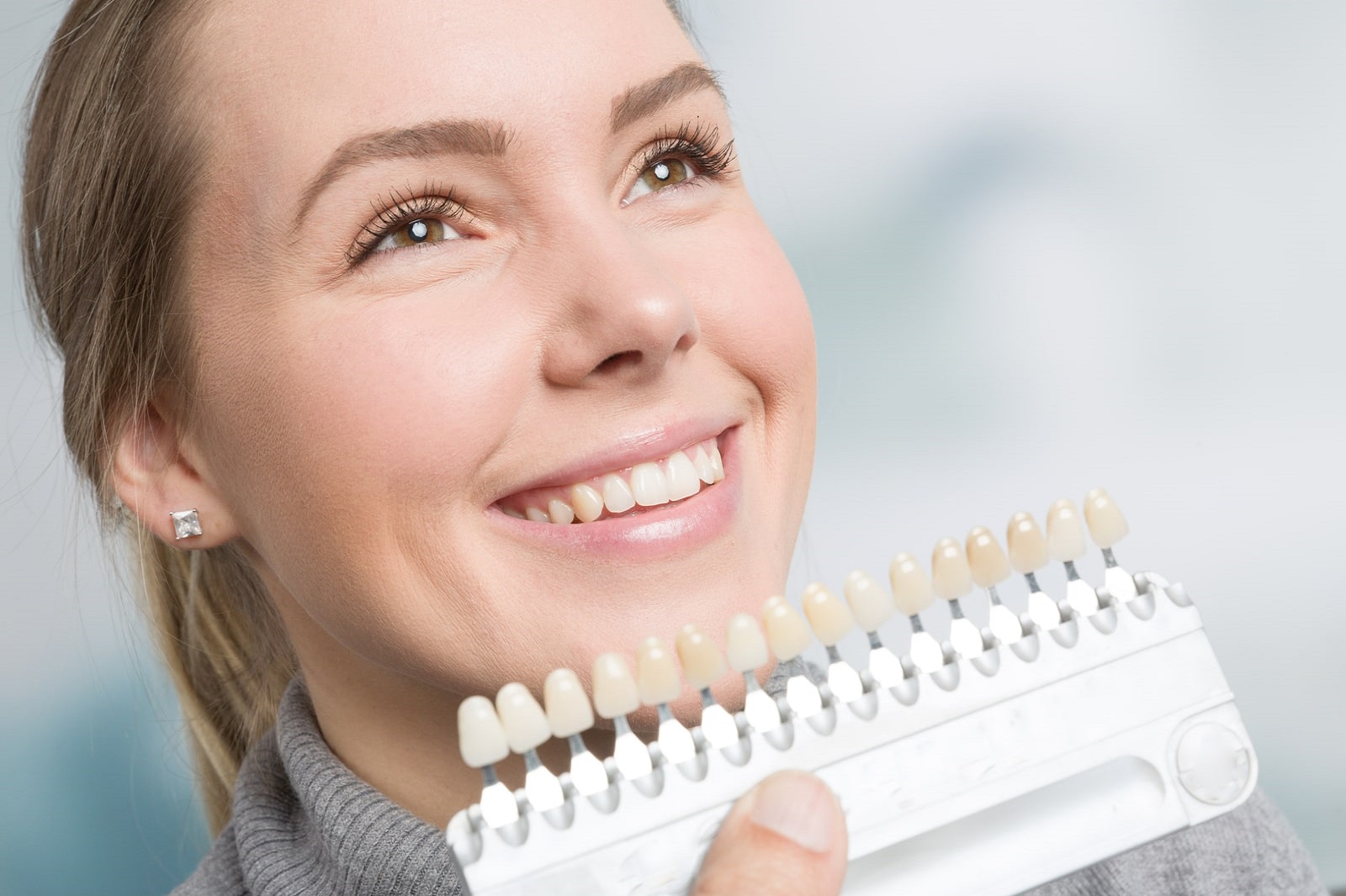 Dentist and patient reviewing veneers results in San Francisco