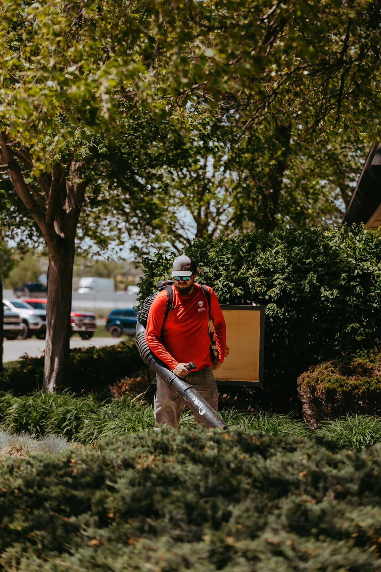 Seasonal cleanup removing leaves from commercial plaza in Wixom