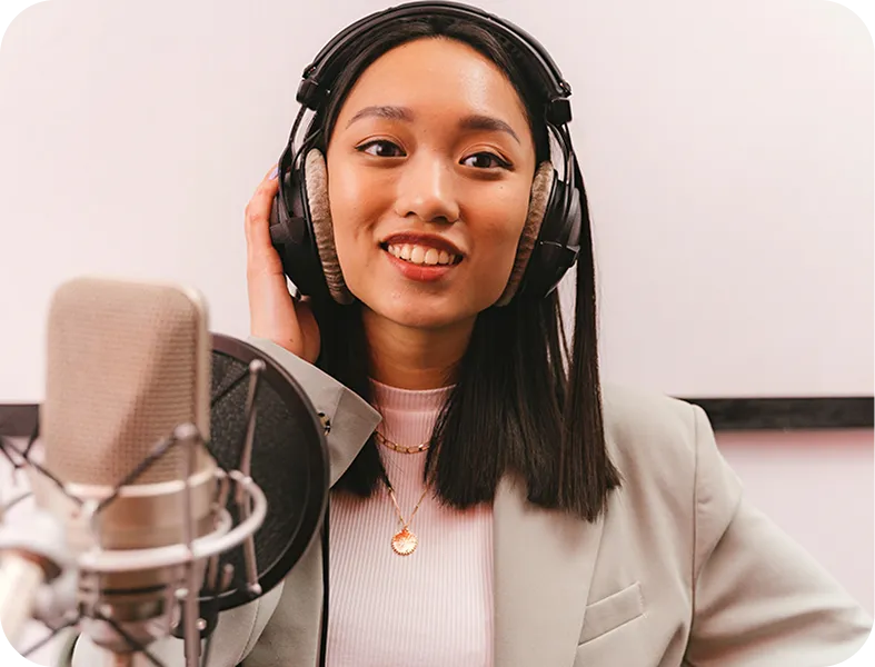 A woman wearing headphones and a microphone.