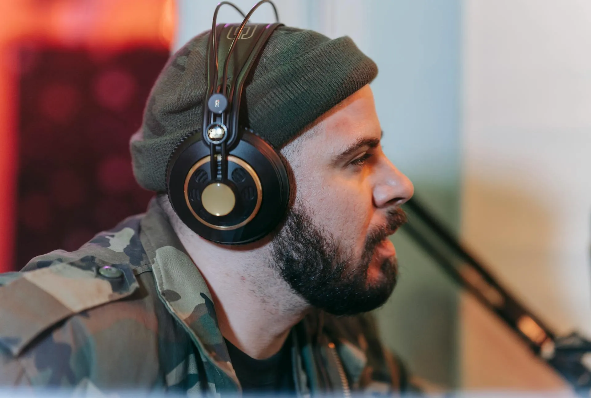 A man with a beard wearing headphones.
