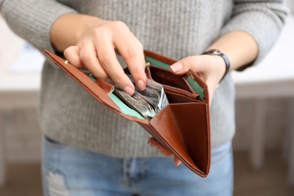 person opening a wallet and take some money