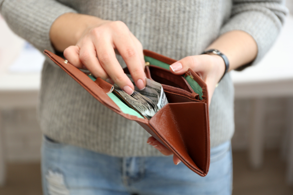 person opening a wallet and take some money