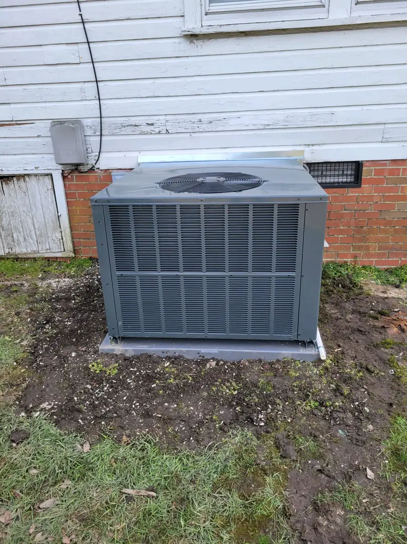 A modern high-efficiency electric heat pump unit installed outside a North Carolina home - how to apply for energy rebates A modern high-efficiency electric heat pump unit installed outside a North Carolina home - how to apply for energy rebates