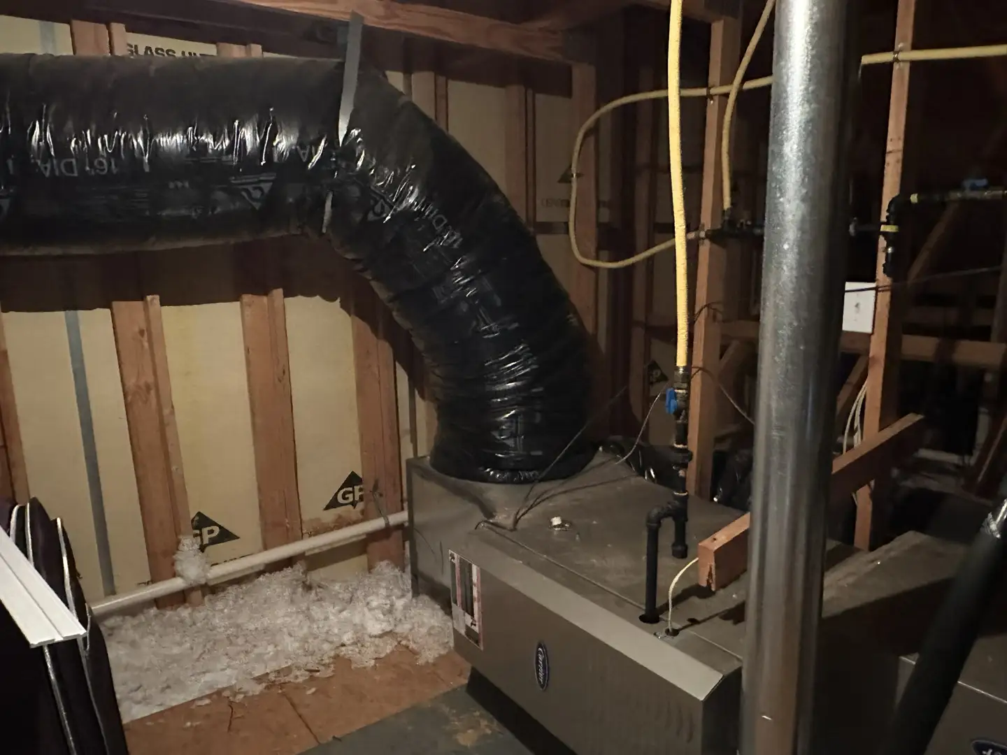 gas furnace components and gas line connections in a residential utility room gas furnace components and gas line connections in a residential utility room