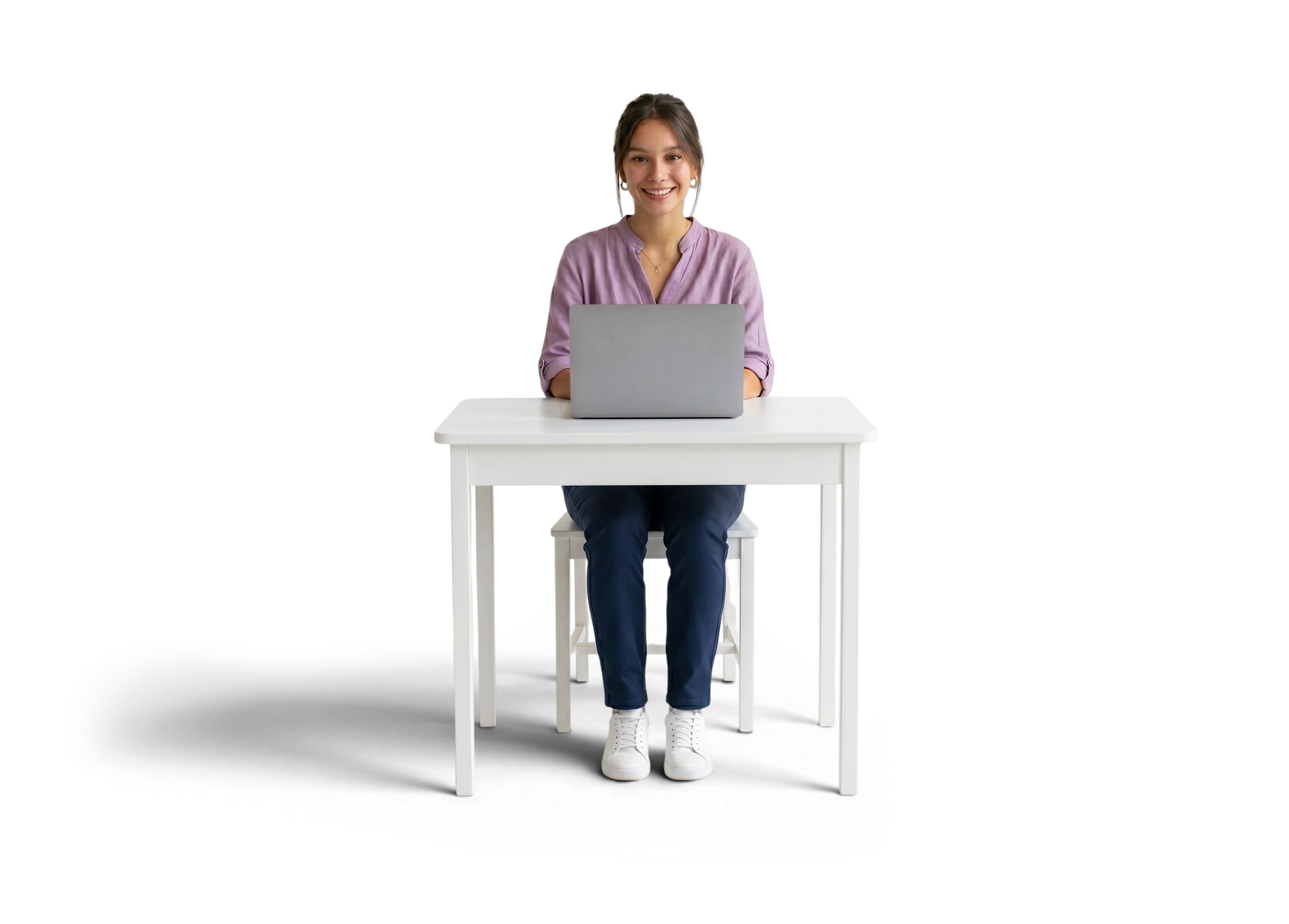 University Student smiling behind a white desk
